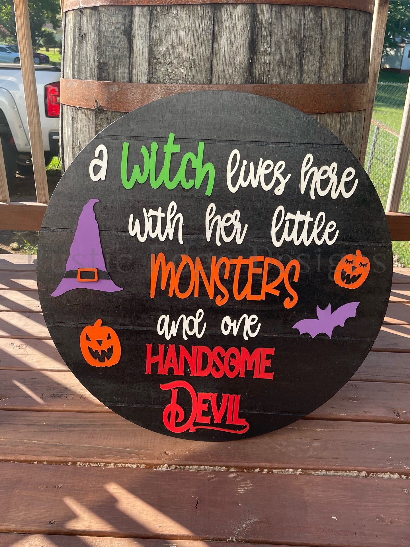 A Witch Lives Here With Her Little Monsters & One Handsome Devil Door Hanger